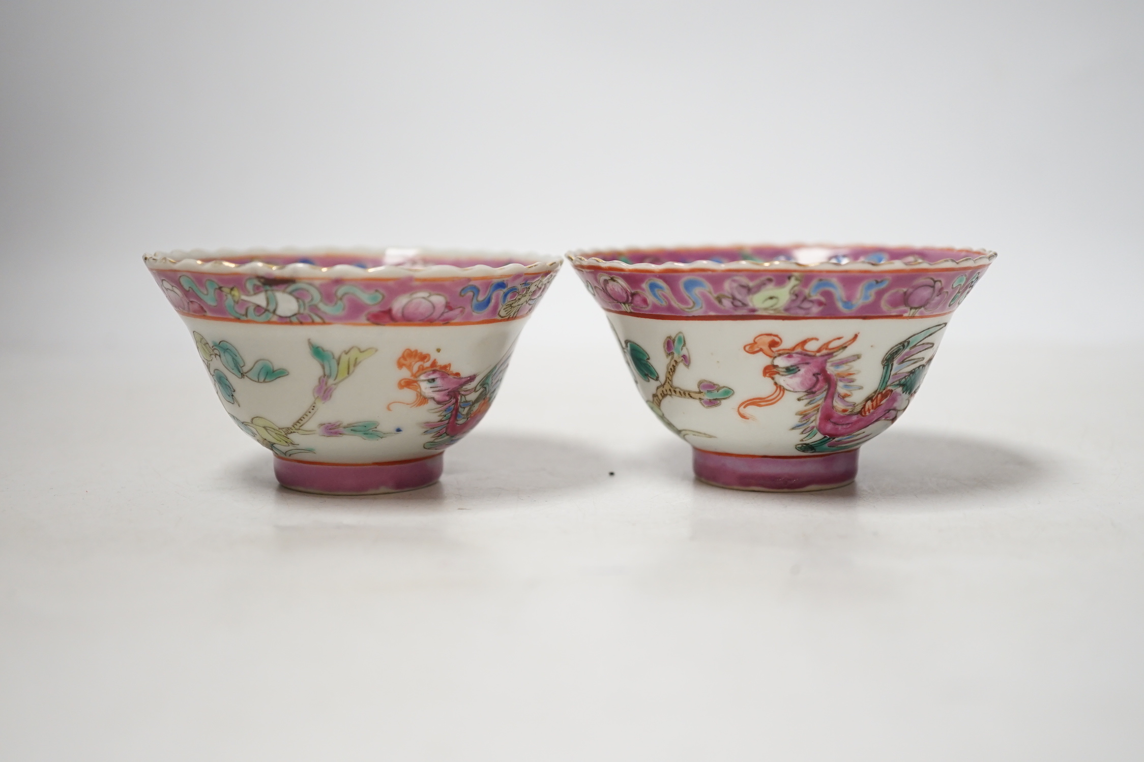 A pair of Chinese Straits famille rose pink ground bowls, Nonya ware, late 19th century, 5.5cm high